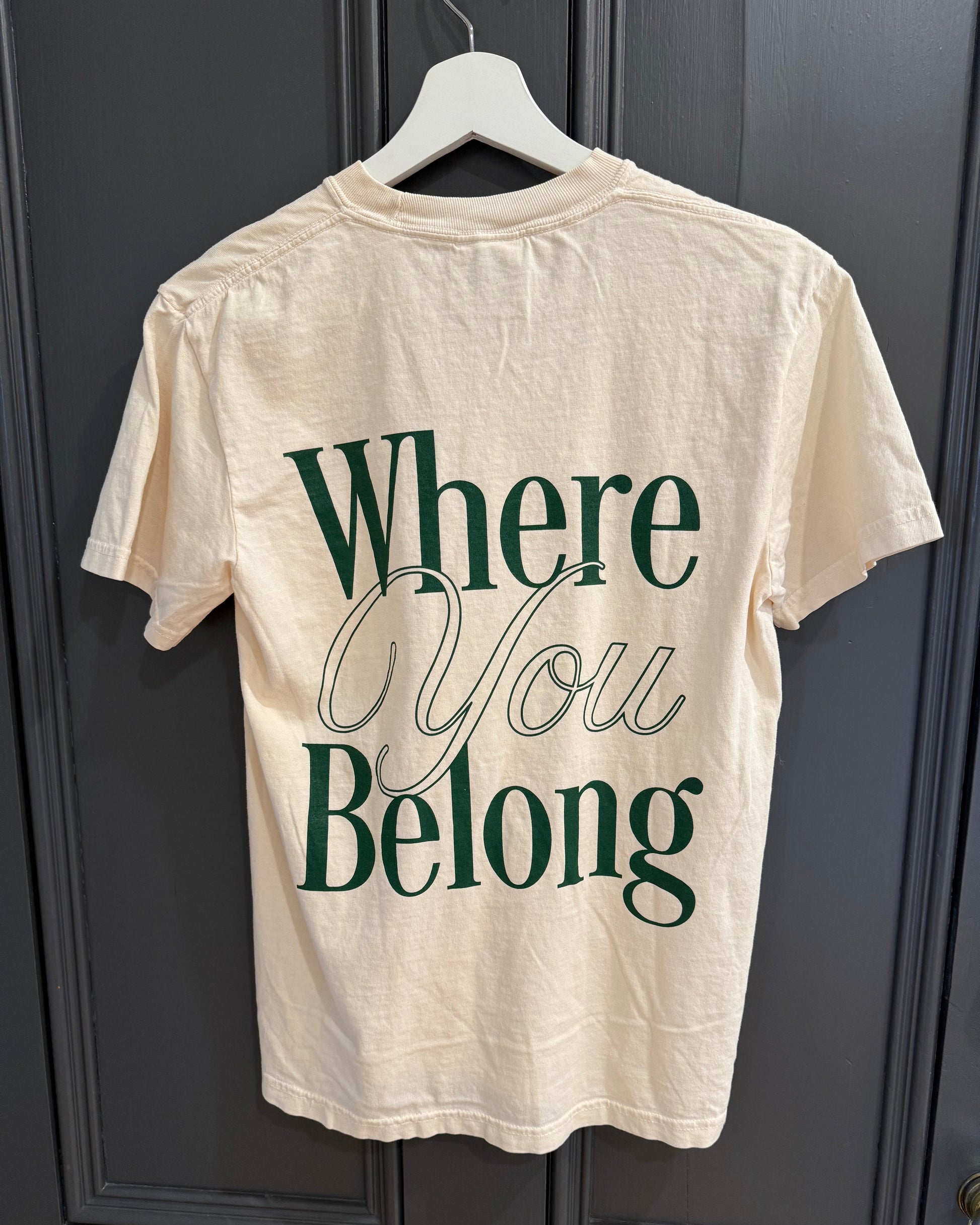 Off White t-shirt with 'Where You Belong' text on a dark surface